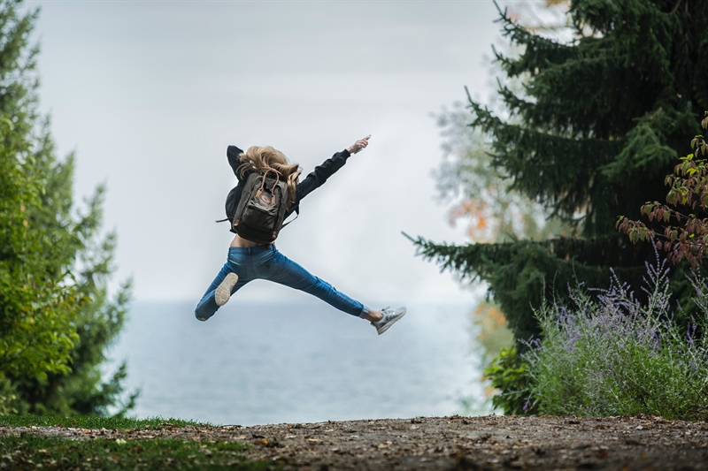 Woman jumping in the forest