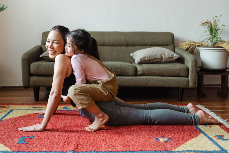 Happy woman with child on her back