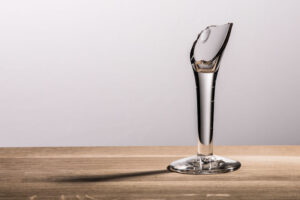 Broken Champagne glass on wooden table