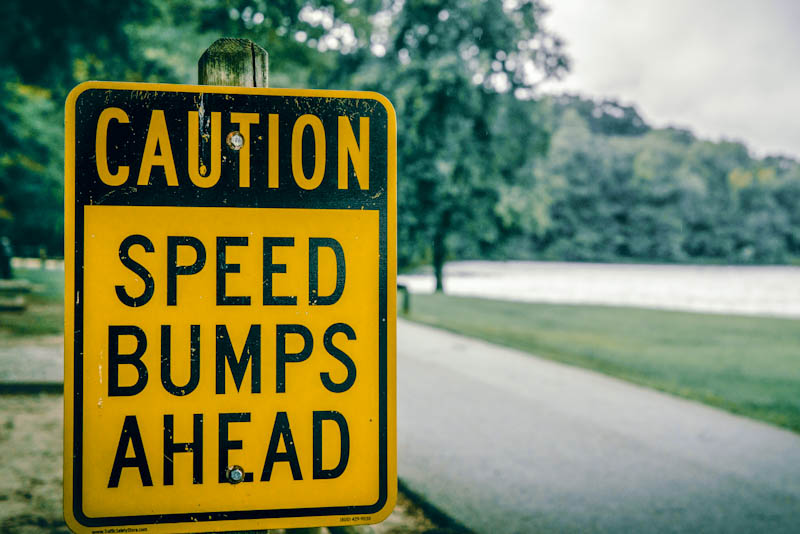 Sign reading, Caution: Speed Bumps Ahead
