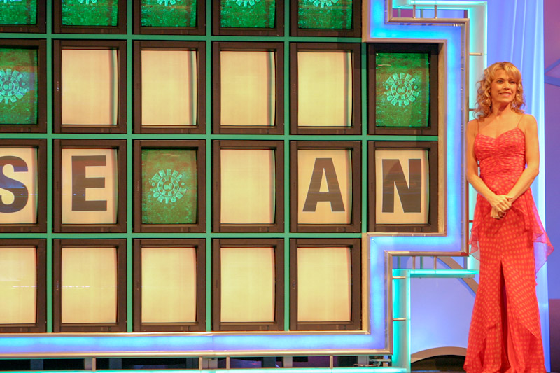 Vanna White at the Wheel of Fortune board
