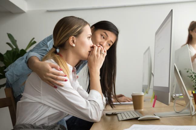 Woman comforting a coworker